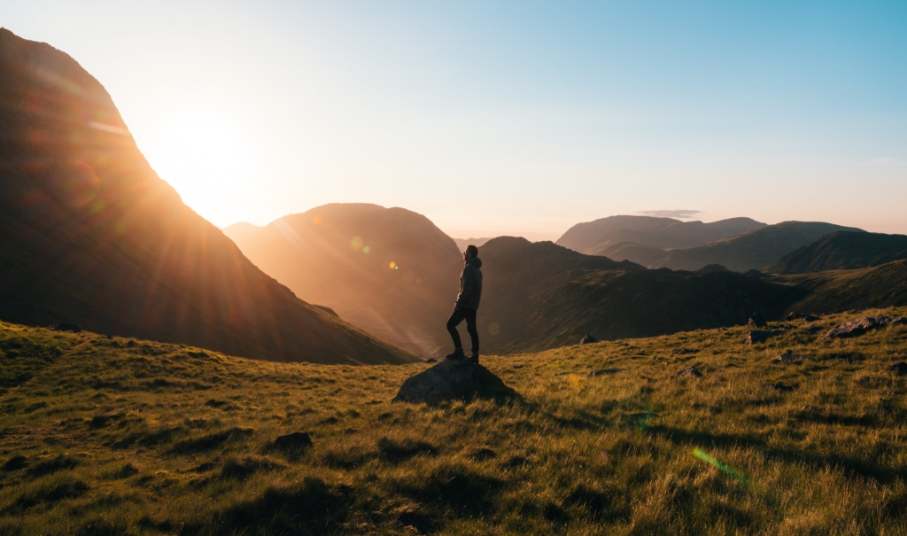 Man in the mountains thining about resolutions